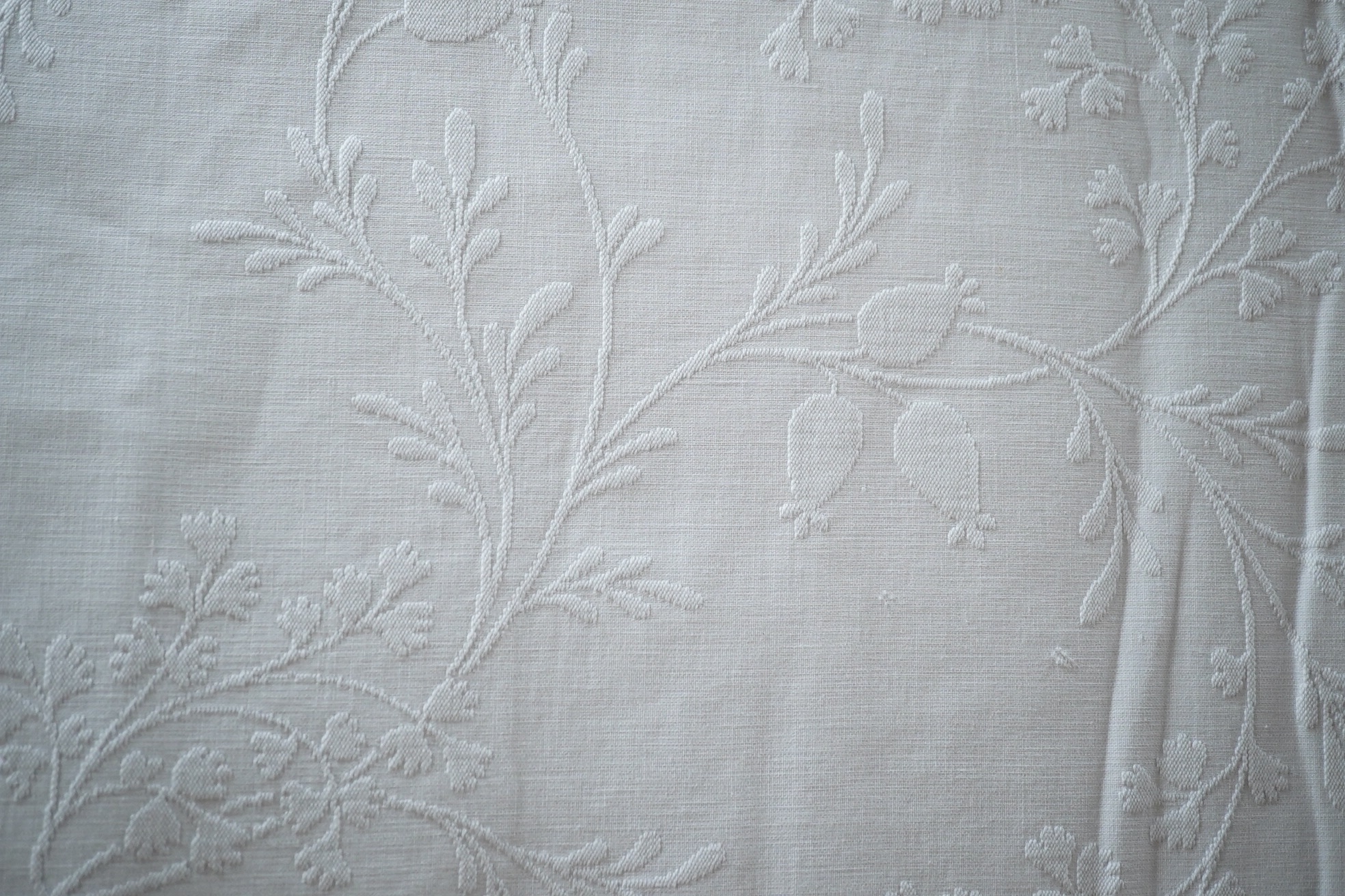 Three late 19th century white linen ‘Marcella’ style bedcovers, with inspired Christopher Dresser floral textile designs.